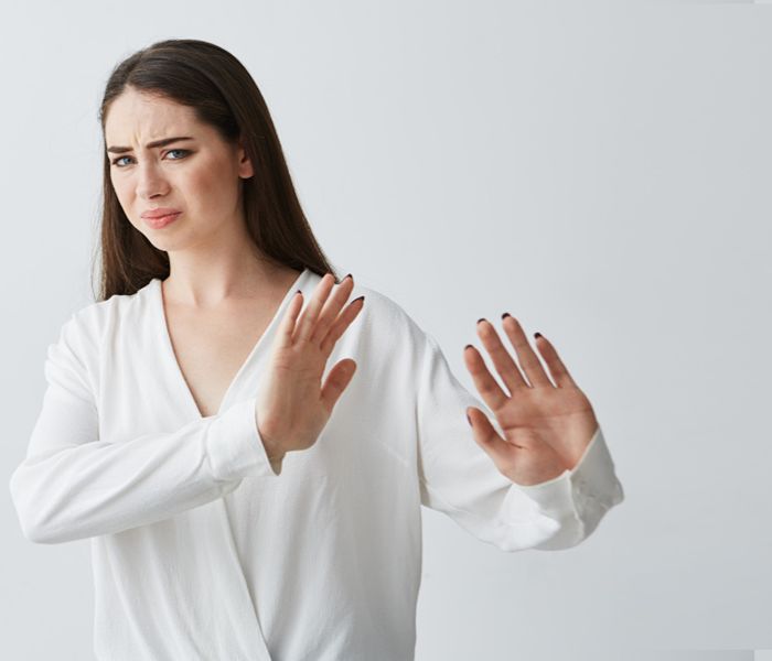 Woman avoiding situations that provoke anxious feelings