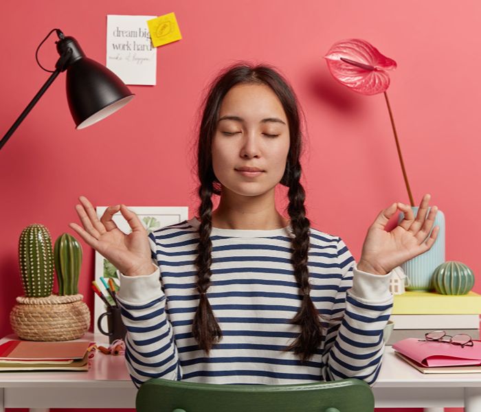 Woman in meditation amidst getting overwhelmed